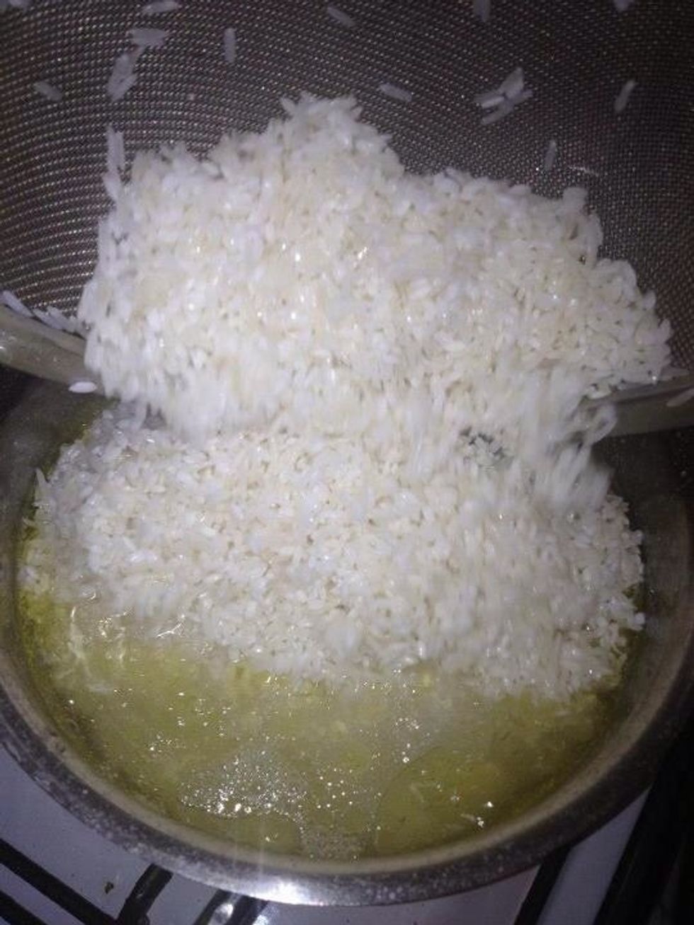 When the water has come to a boil, put the rice