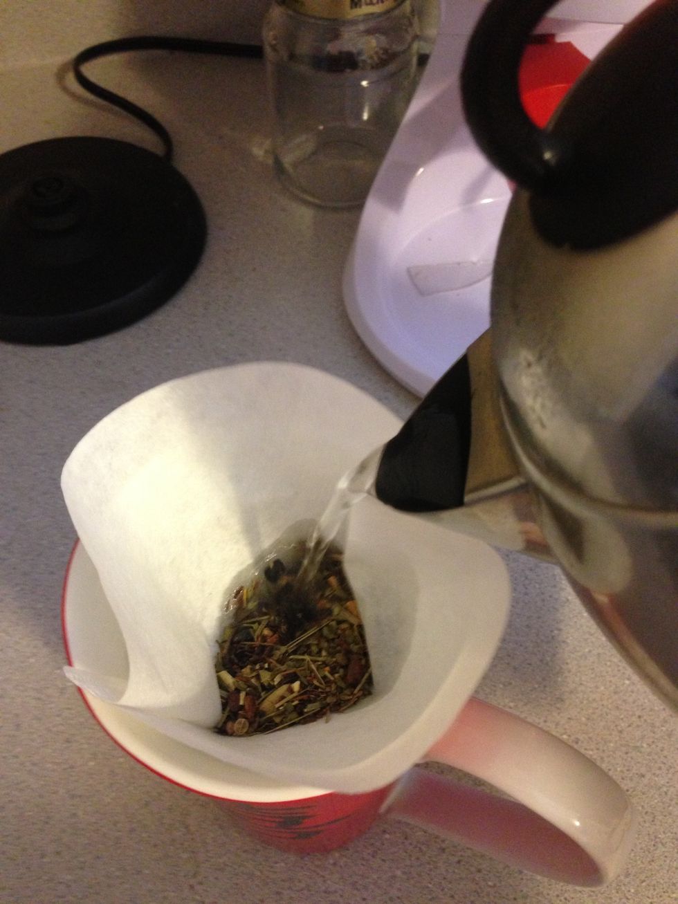 When the water is finished boiling, pour 8 oz into the tea mixture(if you are using filters). If you are using a tea ball, pour 8 oz into the cup.