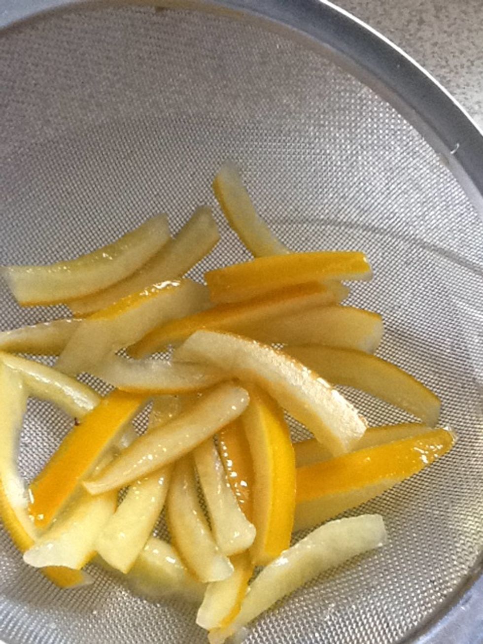 When the white pith is translucent on the edges, drain over a bowl. (The syrup makes yummy cocktails.)