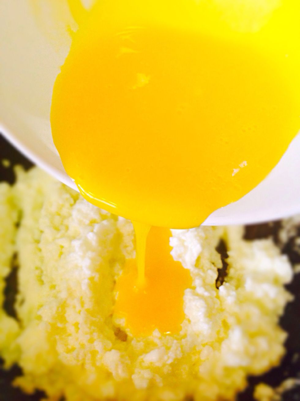 When the whites are cooked add yolks to it. Sprinkle with salt and cook only for about 15 seconds stirring constantly, then remove from heat