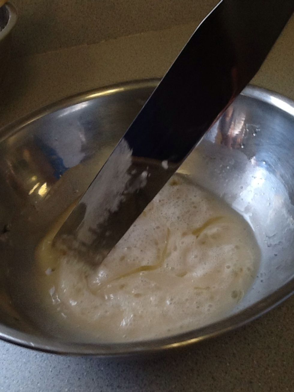 When the yeast is foamy, add the salt and oil and stir well.