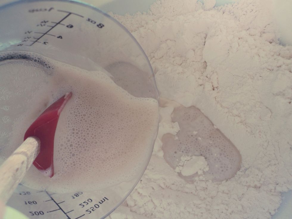 When the yeast mixture is ready, add it in to the flour mixture.