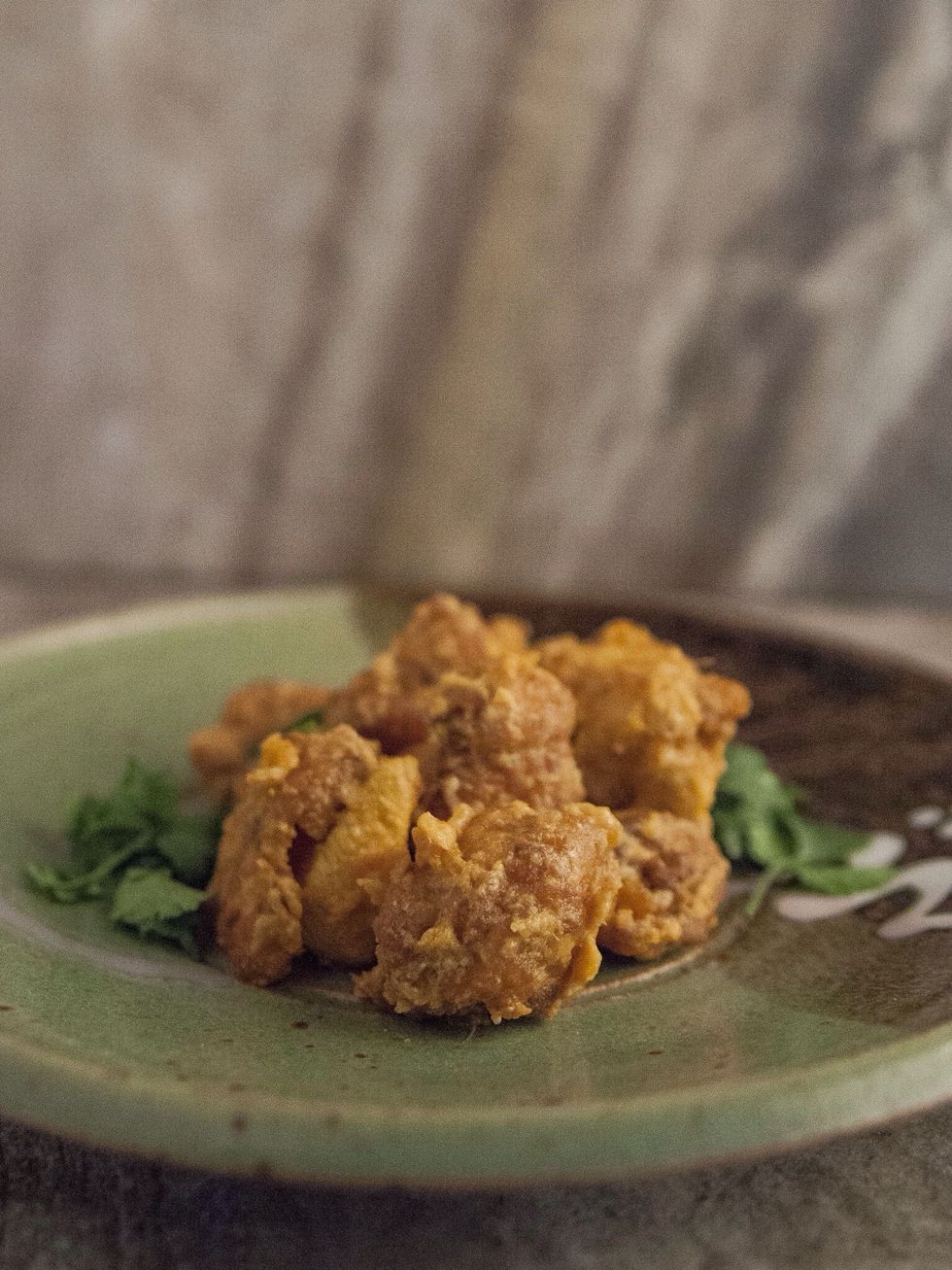 When the yogurt is absorbed into the chicken it's done. Plate it, sprinkle it with a bit of chopped fresh cilantro and serve it up!