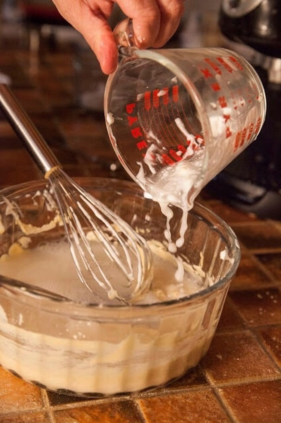 When the yogurt is thoroughly incorporated, add in 1 cup of water.