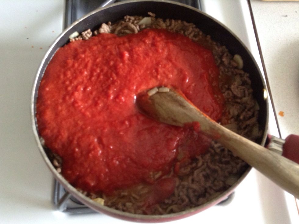 When there is no more "pink" meat, add the tomato sauce