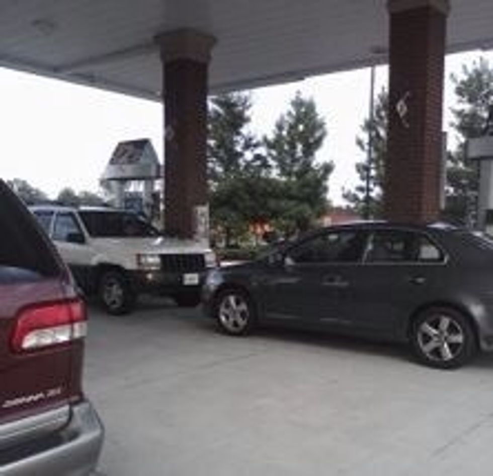When there's a long line at the gas pumps, let another car go before you.