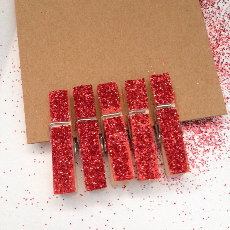 When they're all done, cover them with something to make the glitter stay. I used some old hairspray and it worked pretty well. Pull them off the cardboard and set aside to dry!