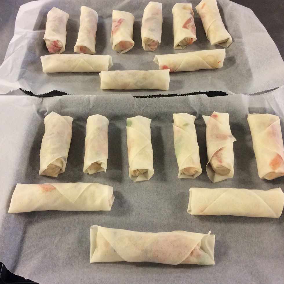 When they're all rolled up, put them in a baking sheet