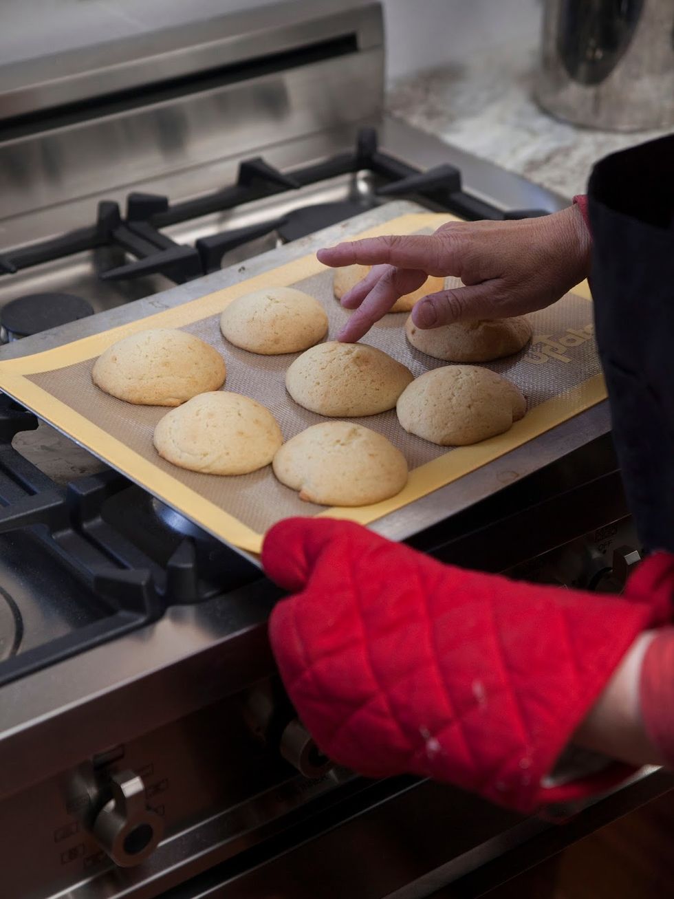 When they're puffed and lightly golden, make sure they spring back at your touch. If they do, they're done. Place them on a cookie rack to cool and start making your icings.
