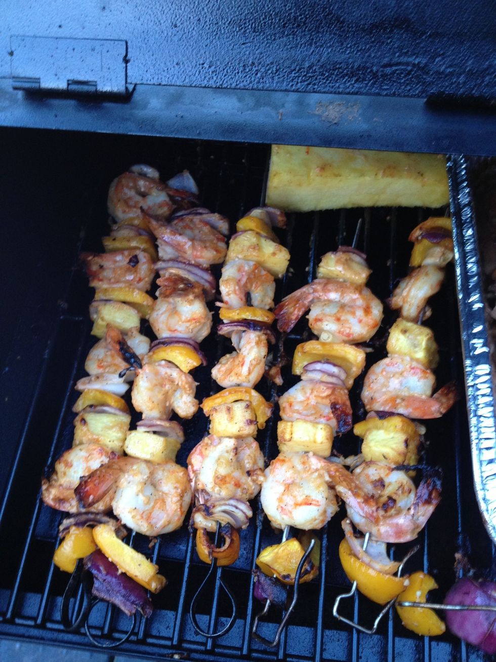 When they turn pink and flesh is somewhat firm the prawns are done. Remove skewers.