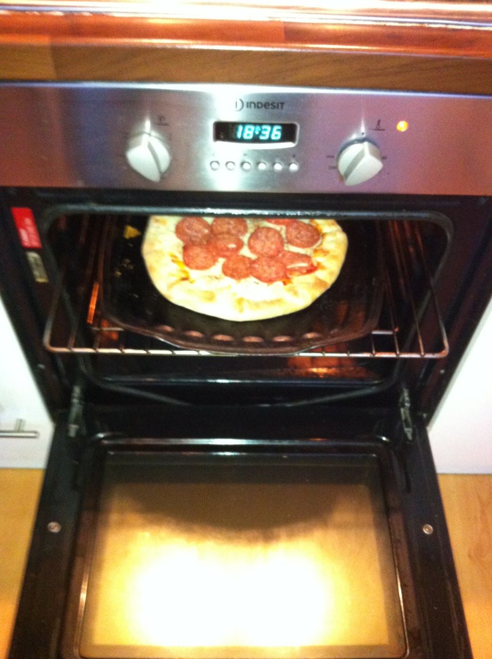 when ur ovens pre heated pop the pizza in where the pizza box says.