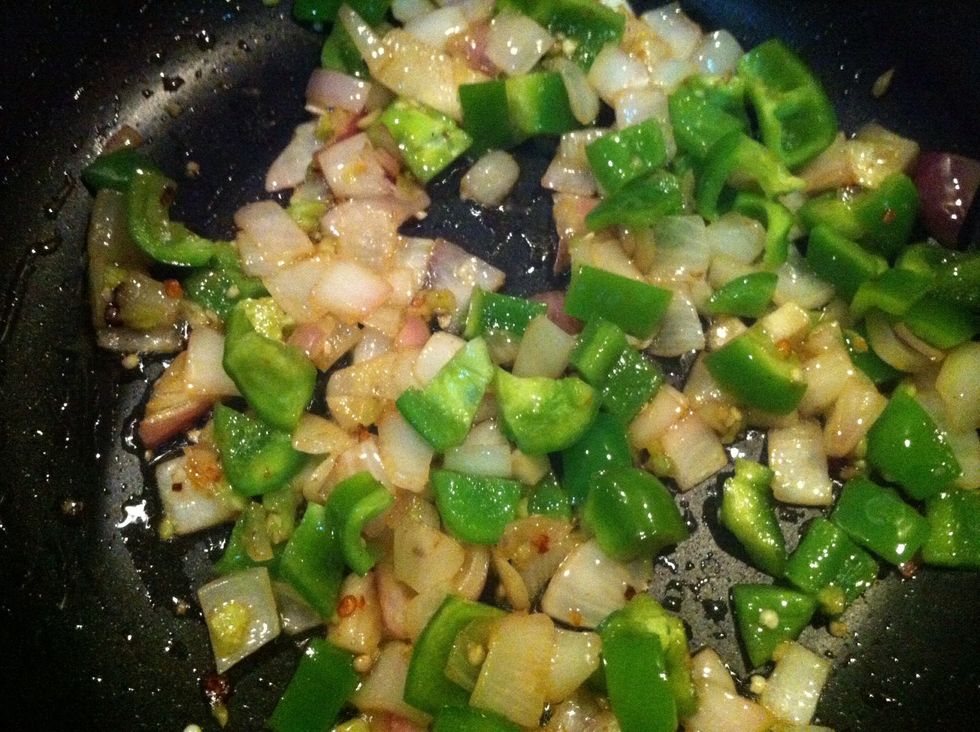 when water is evaporated add onion and capsicum and fry