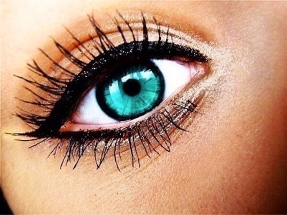 When you apply mascara place the brush under the eyelash and blink. As you blink push the brush up .