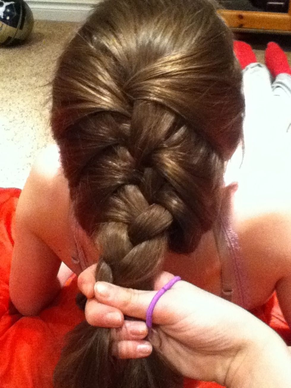 When you are around 1/3 down your hair put in a hair tie.