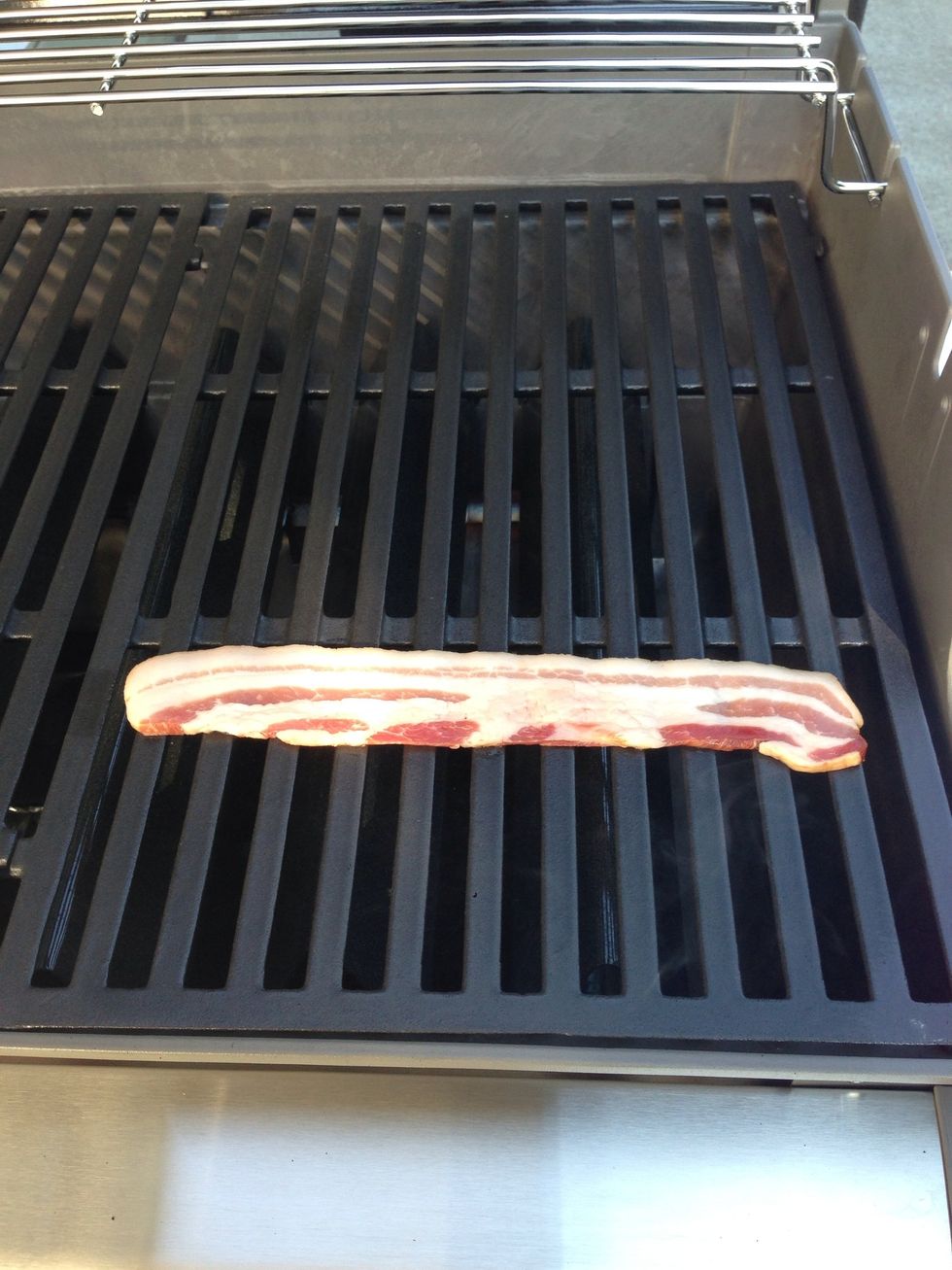 When you are done, add a slice of bacon to the grill.