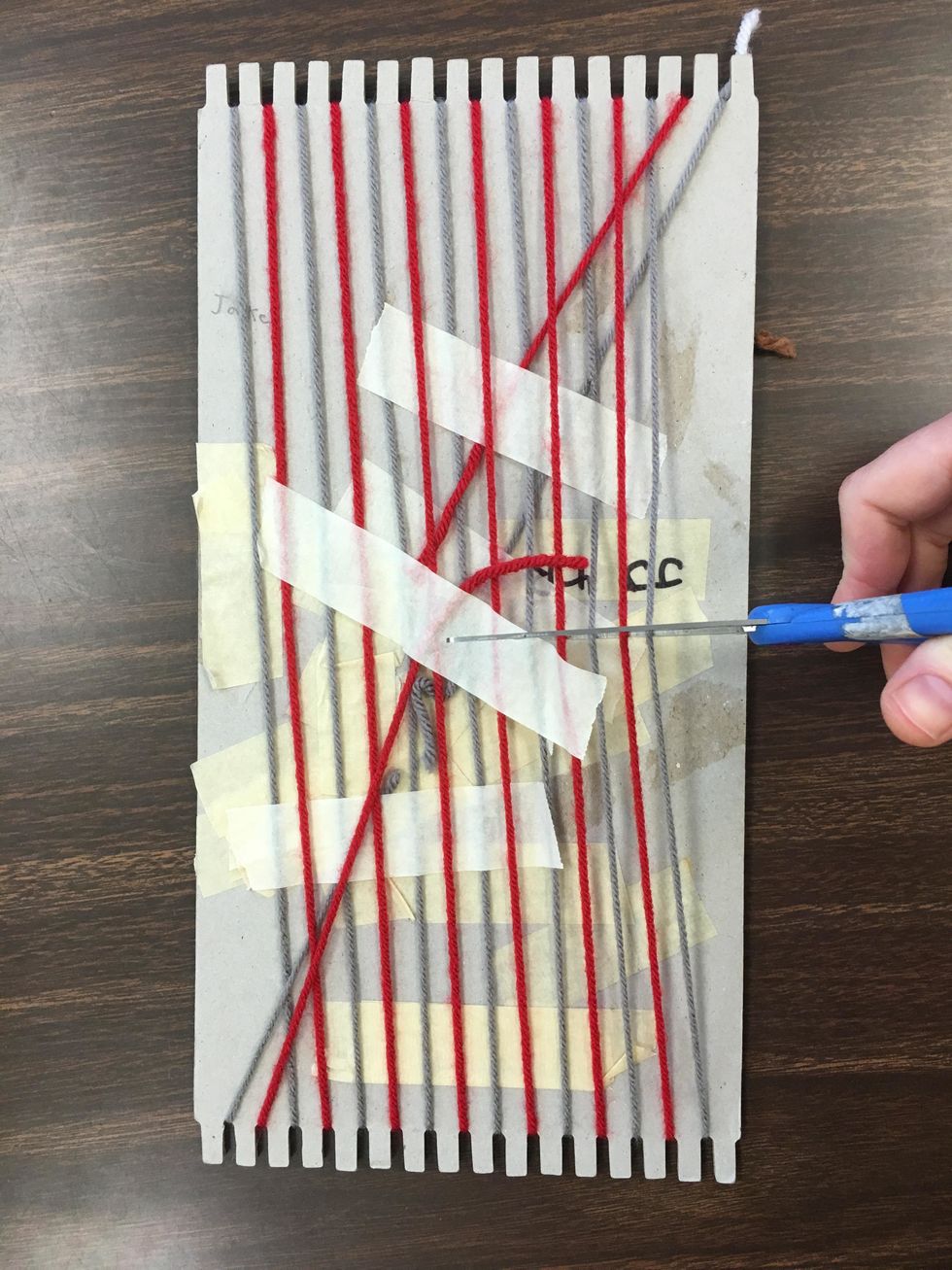 When you are done, flip the project over, and with your scissors carefully cut all the yard on the back of the cardboard straight across, and remove the tape.