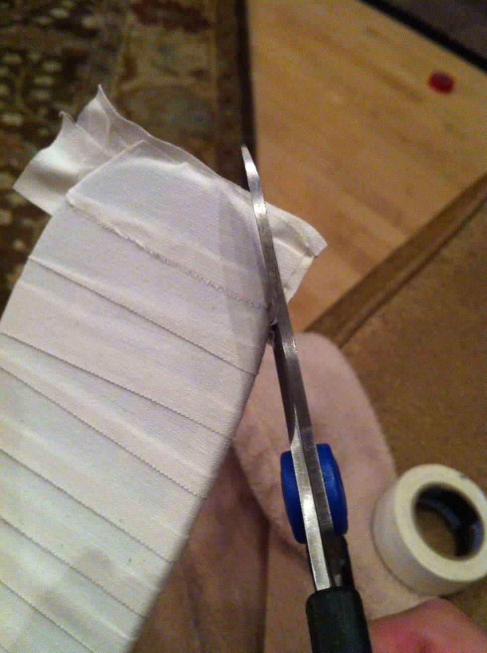 When you are done get the scissors and cut the tape that is hanging off the toe. You will see the out line of the toe, just trim around it, don't cut the stick.