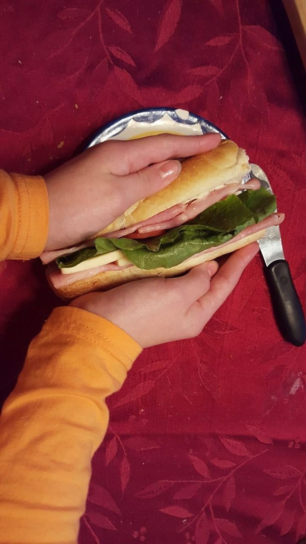 when you are done grab the slice of bread with only two slices of ham and lay it on the side that has all the other ingredients. if you squeeze the sandwich together it is less likely to fall apart