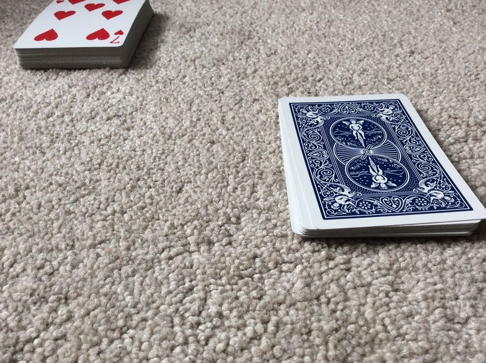 When you are done repeating steps 20 - 23, you take the face-down pile, but this time you flip the cards face down, then face up. To add effect, you can say that you're gonna try to shake things up