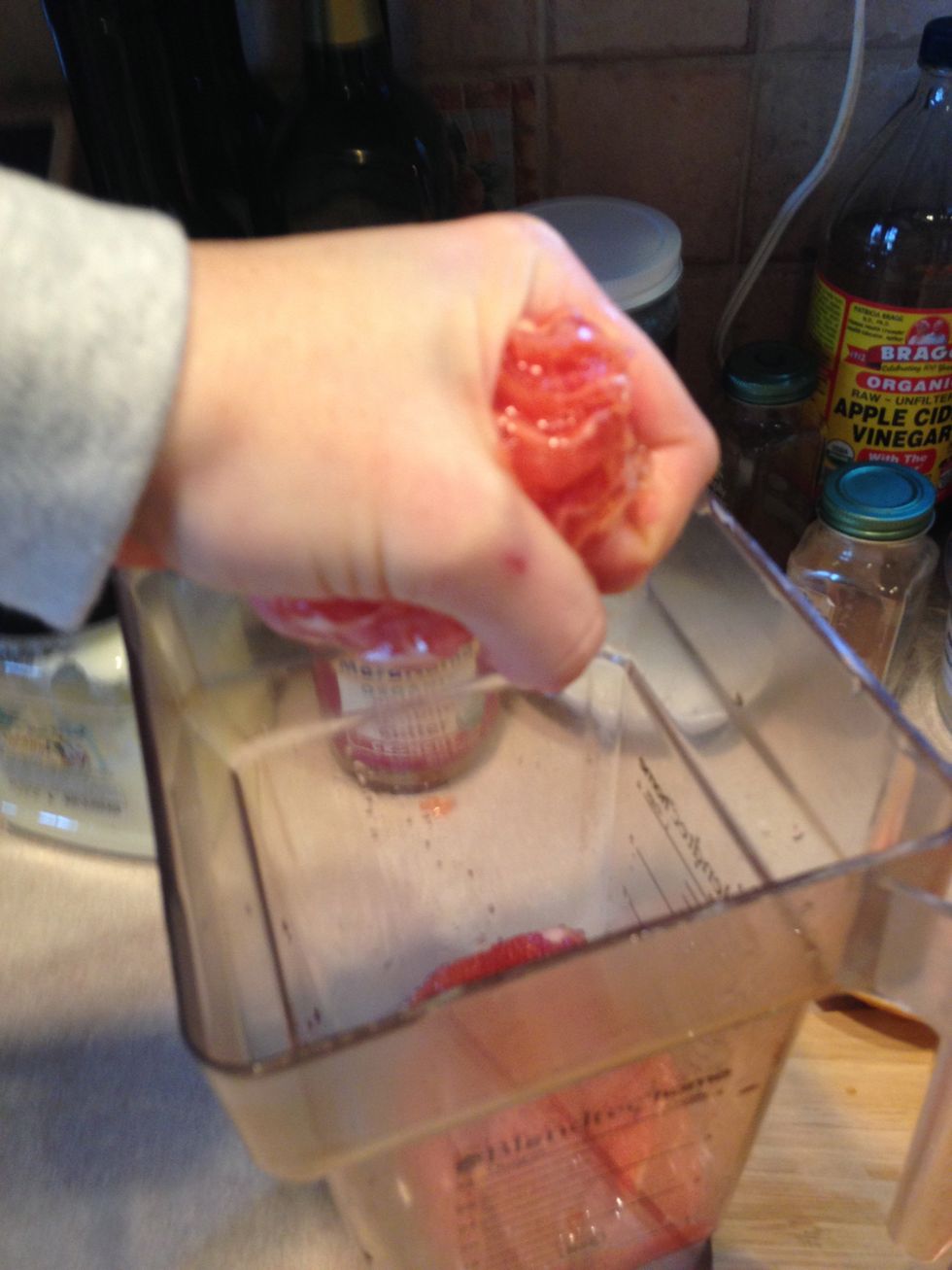 When you are done slicing your fruit all the way around take the remaining fruit and squeeze out all the juice you can into your blender. Do the same with the rind slices from earlier.