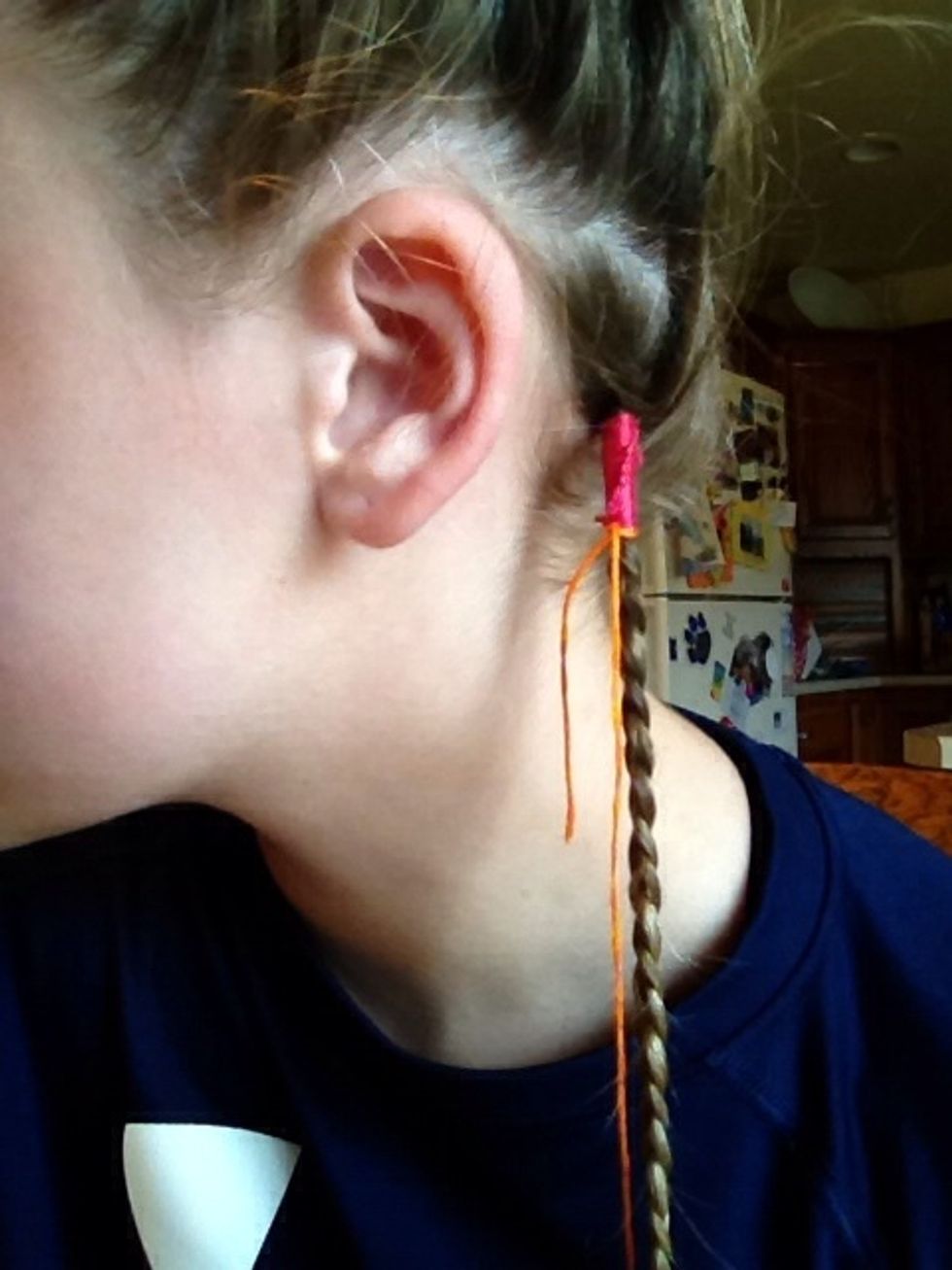 When you are done with the first color cut the tail of the color close the the wrap and then repeat