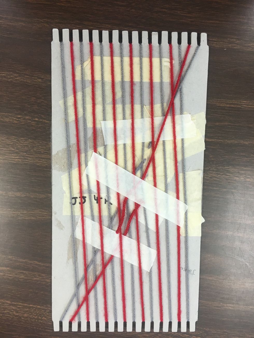 When you are done with the other yarn, flip your loom over and secure the other yarn on the back as well.