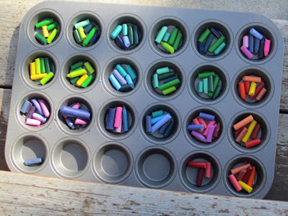 When you are finished, put the crayons into the holes. You can put them however you want. You can also use different shaped tins if you have them. You can also add some glitter to the crayons.