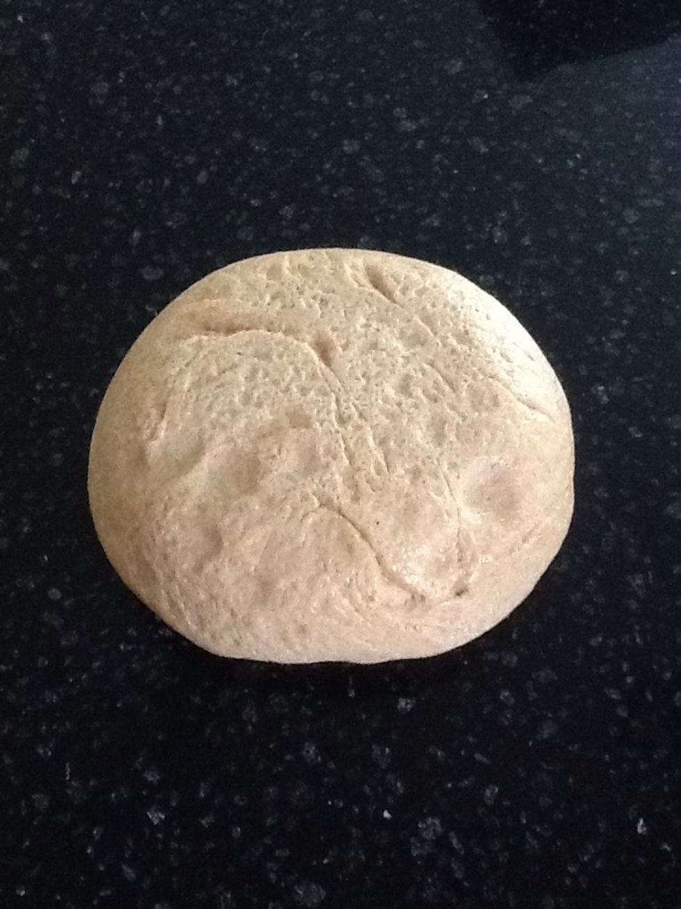 When you are ready to make the pizzas, turn dough out onto a floured work surface. Divide dough into four pieces, two big and two small.