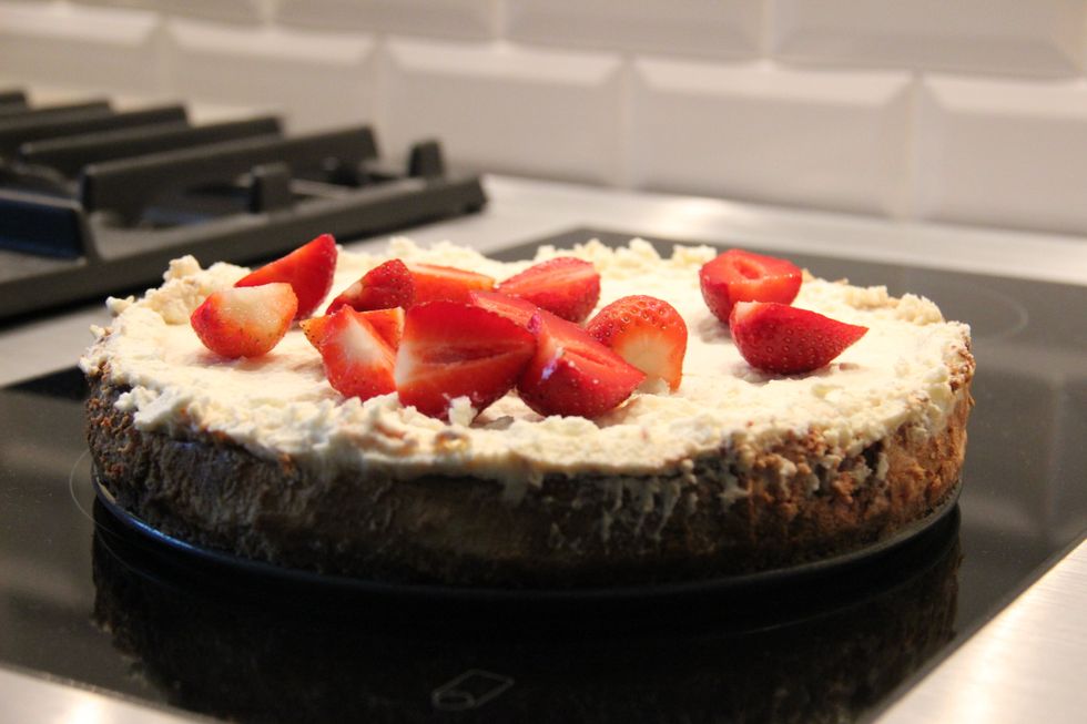 When you are ready to serve, top it with fresh strawberry halves. Enjoy!!