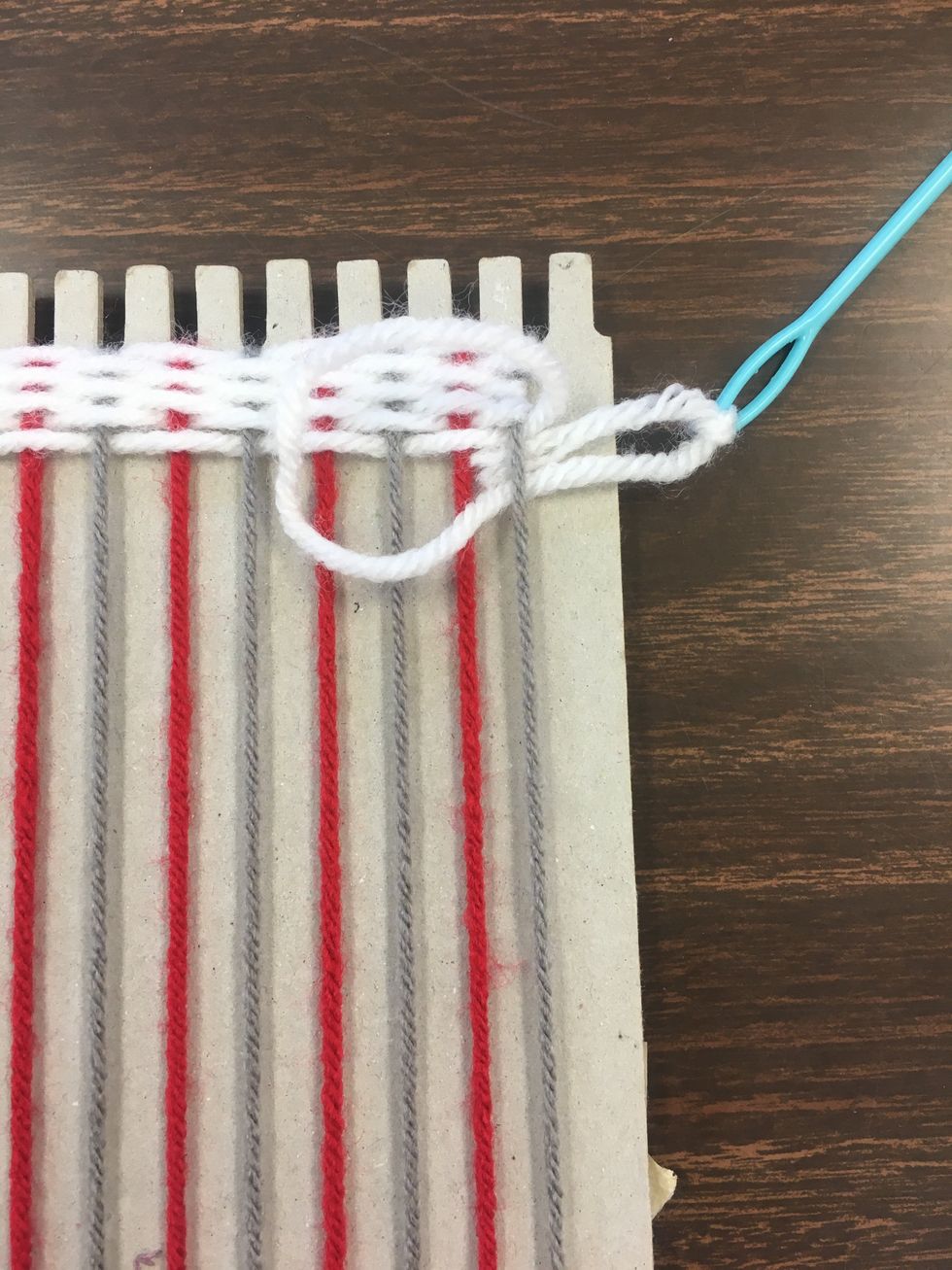 When you area done with a color of thread, you need to pull the thread taught, and tie an gentle knot on the end piece of your base thread.
