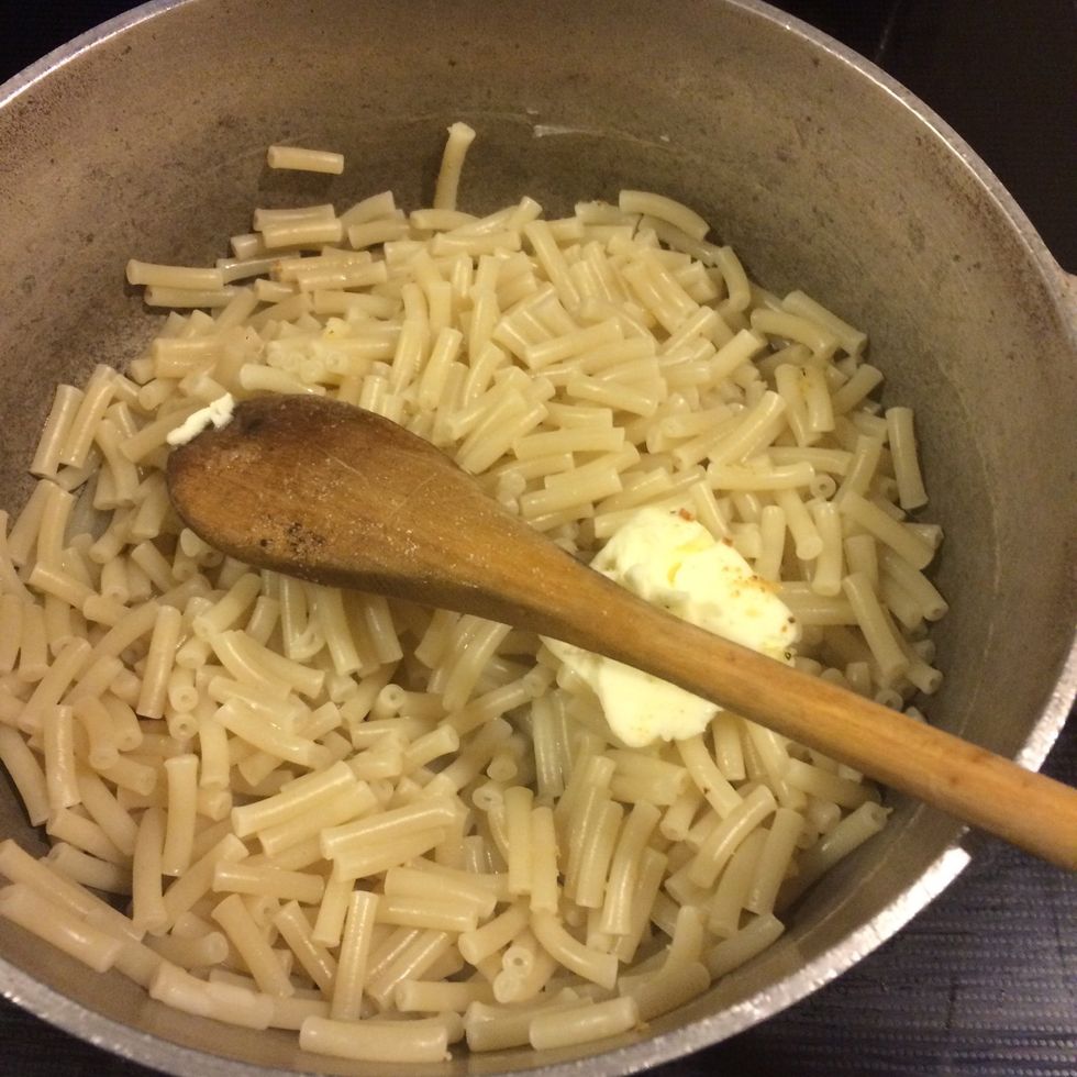 When you boil your macaroni , add some butter to it. Make sure it's buttery because of the dry ingredients that's a coming