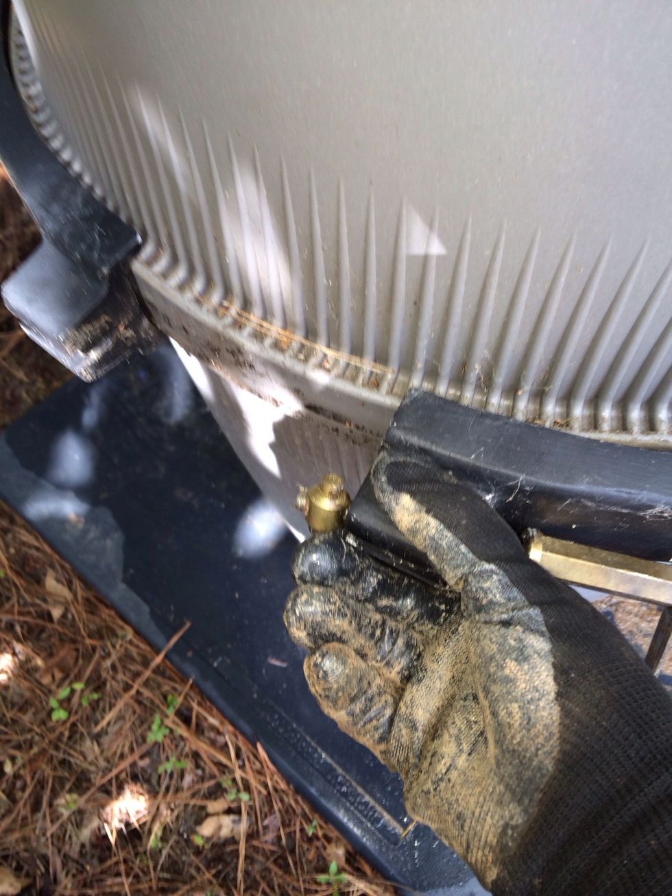 When you can remove the steel band and place it to the side. You're going to hose this down later to clean it up