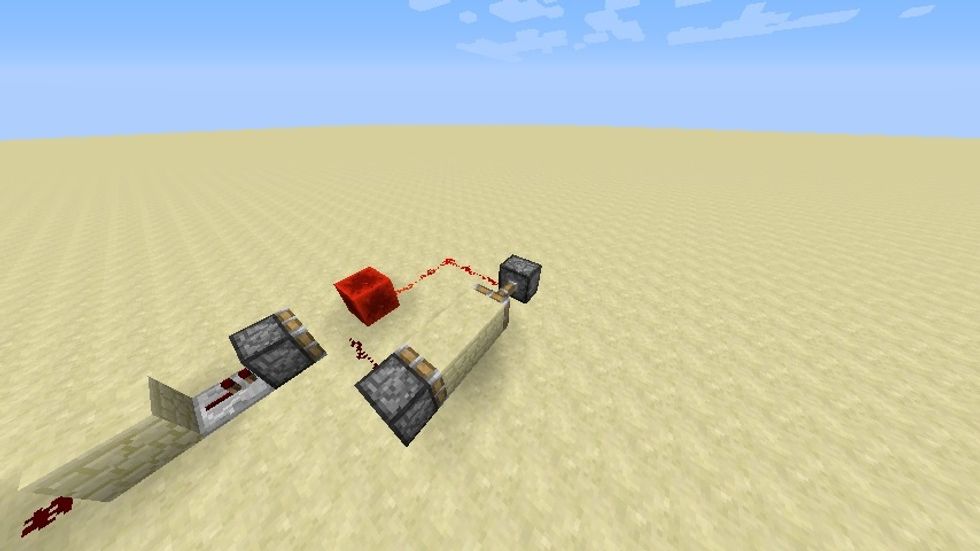 When you click the button, the blocks will swap and you will get this. This is called a block swapper which can be useful in many redstone circuits.