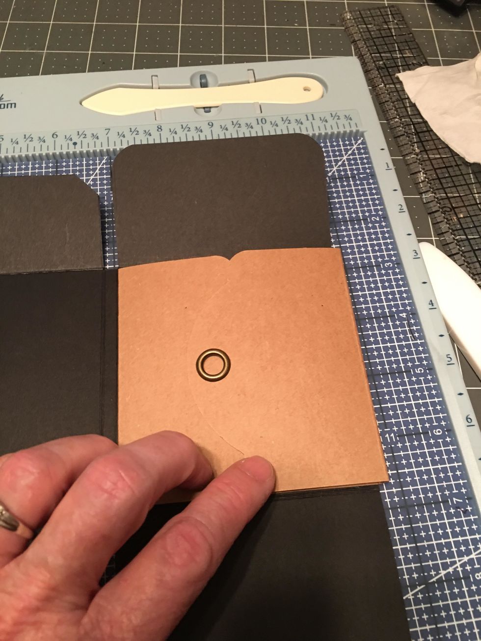 When you close the flap it should look like this with the finished grommet on the outside as shown.