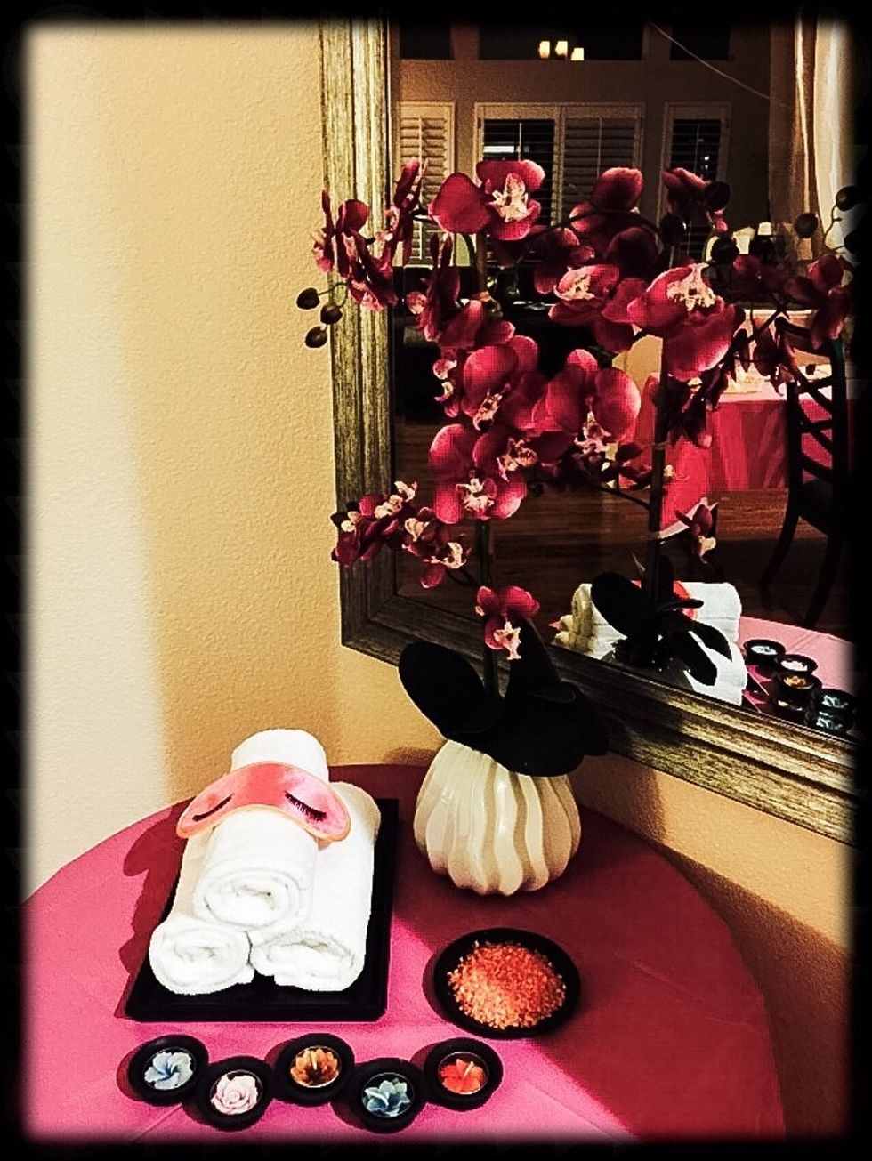 When you decorate for a spa party think spa:  Orchids, flameless LED candles, curtains, bath salts, rolled towels, bamboo, river stones etc. Opal wanted her birthday theme colors to be pink/orange.