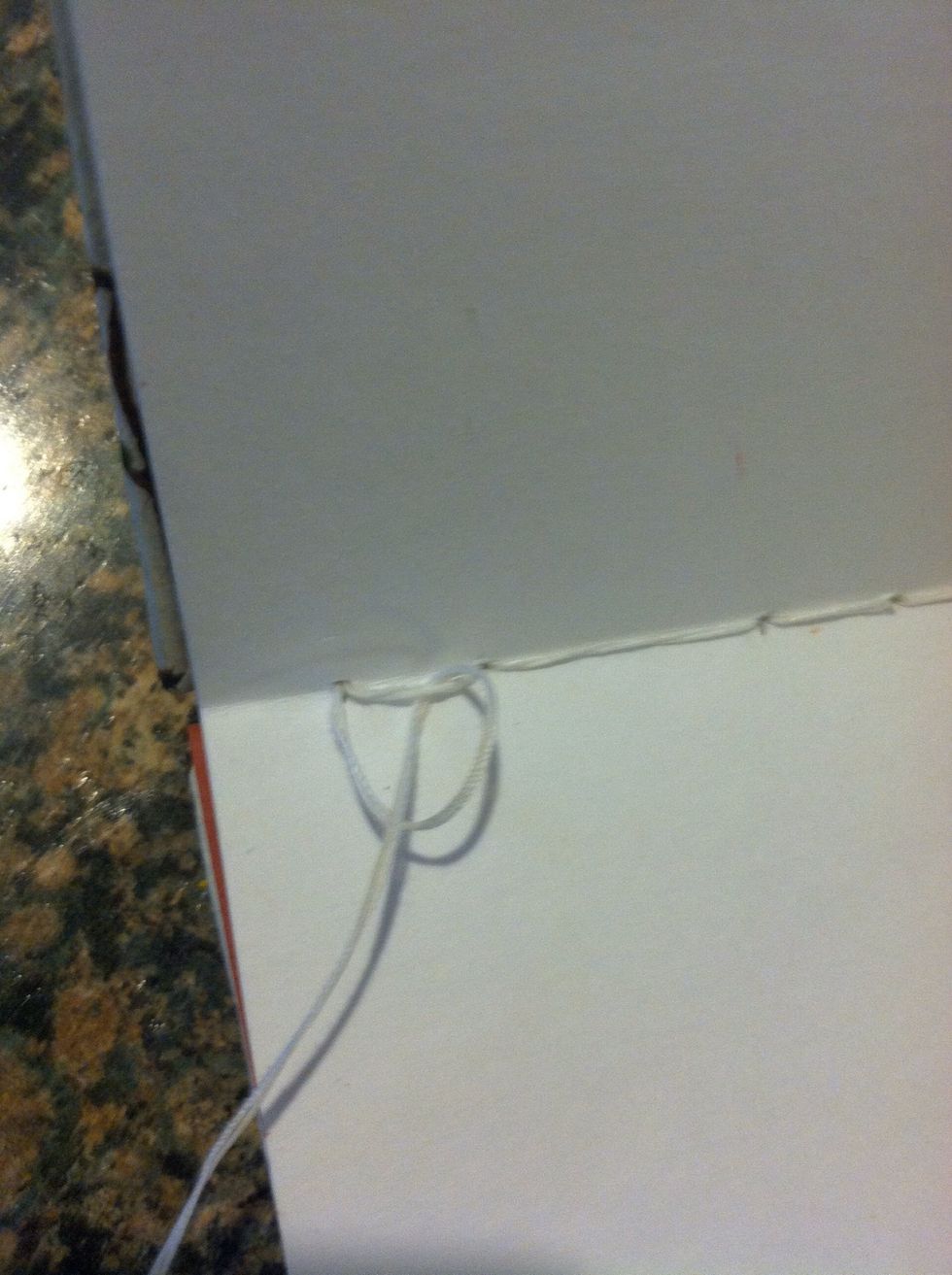 When you end on the inside of the last station, of the last signature tie a knot to end the binding