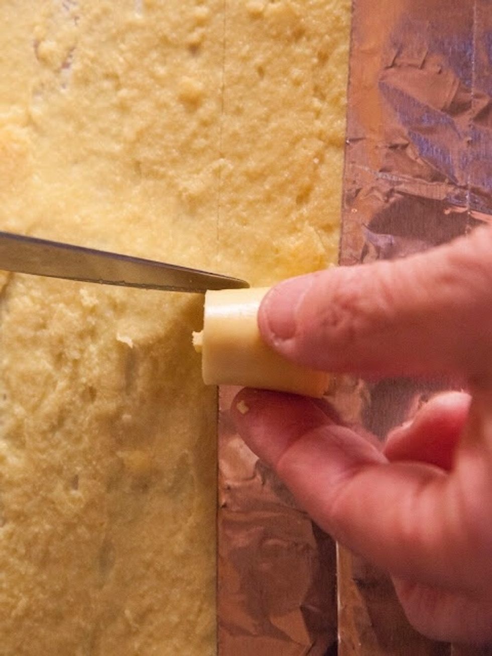 When you feel it's the right bite size, cut it and place it on a serving plate. Keep doing this until all the batter has been cut and rolled.