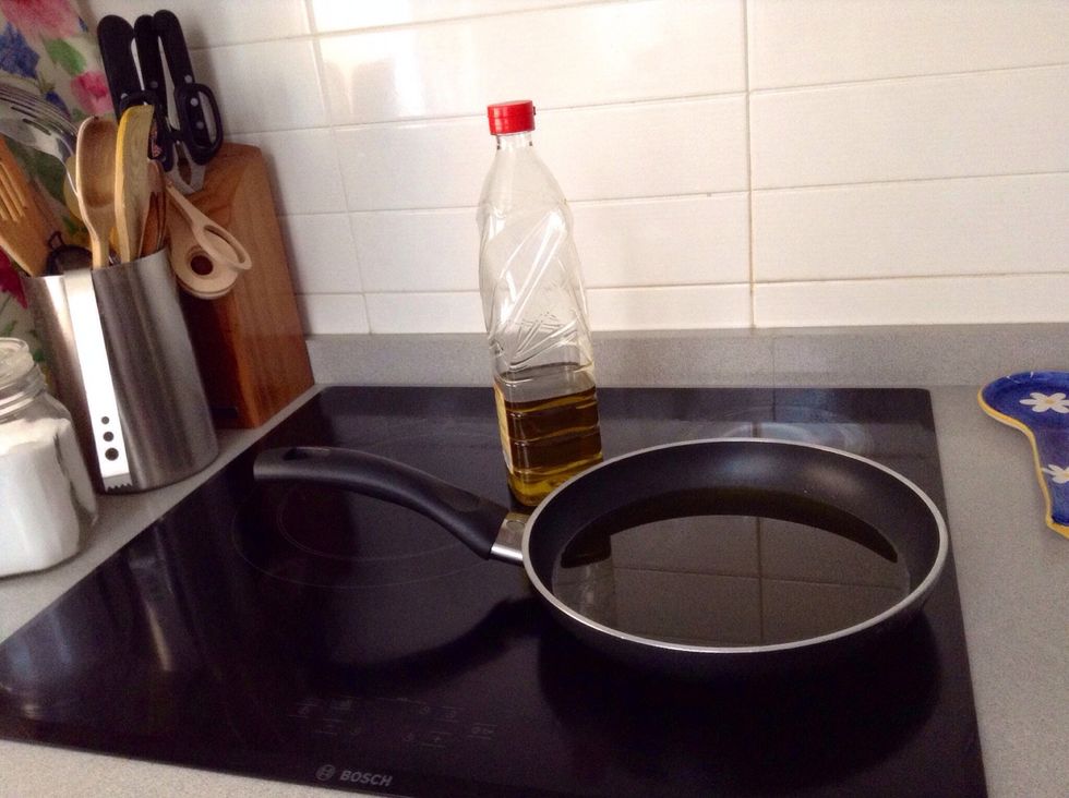 When you finish cutting potatoes, heat olive oil in a medium/large frying pan. Heat it over medium high.