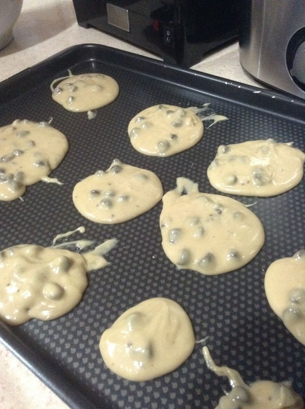 When you finish putting the cookies on the tray put the tray in the oven