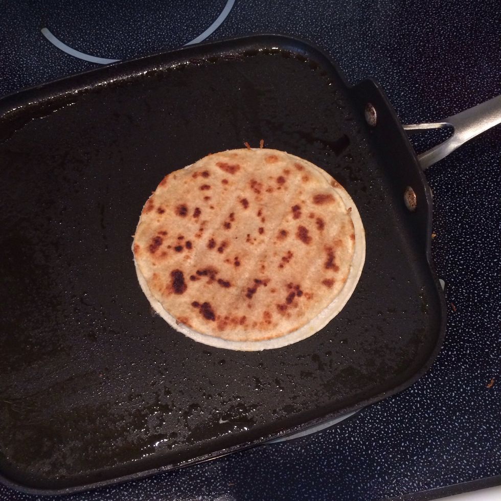 When you flip over the quesadilla, the cooked side will be smaller.
