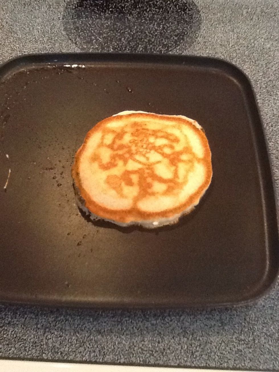 When you flip, your bottom side of the pancake should look like this. Cook a minute or two, then flip your pancake onto a plate.