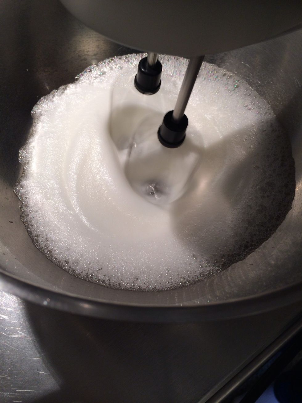 When you get soft peaks. Add the 10 g of granulated sugar. 1- 2 mins start adding the sugar mix in three times. Beat until sugar is melted and the batter is shinny and form stiff peaks.