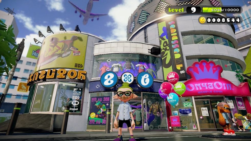 When you get to the shop, buy items like guns,shoes,headwear and shirt with the Splatoon money that you earned.