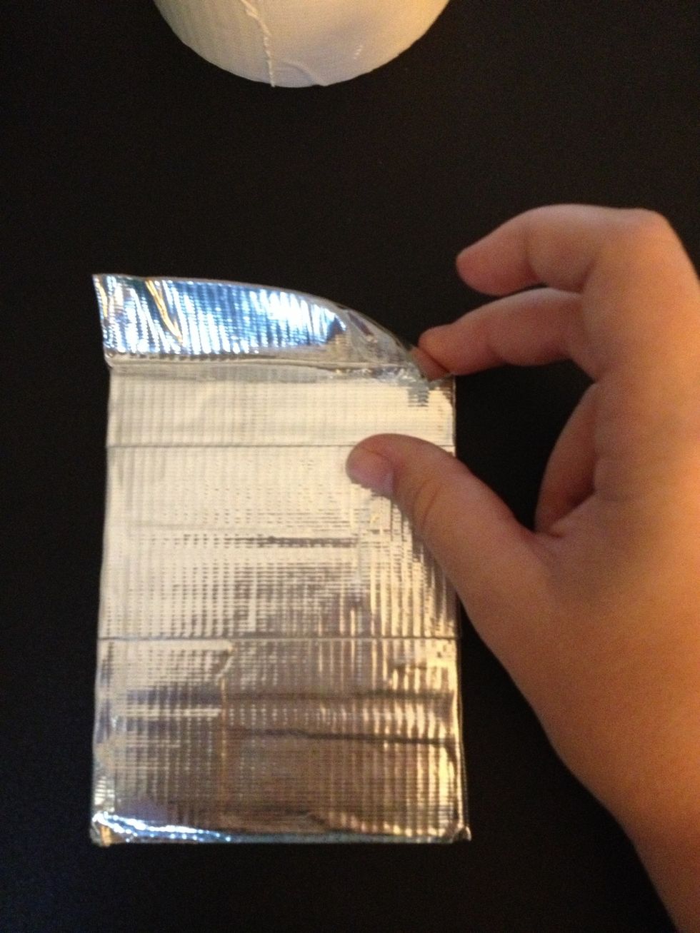 When you get to the top of your shape just continue as normal and just leave a flap (like shown in the picture) of tape on the top and cut it off.