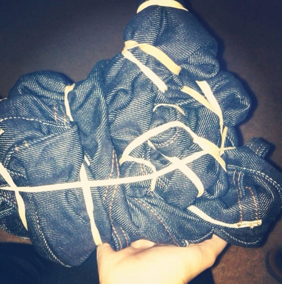 When you get to the waist of the jean, bunch everything together and secure it with a couple more rubber-bands.