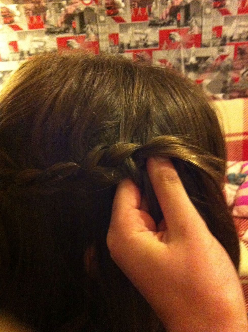 When you get to your ear, start to curve the braid upwards.