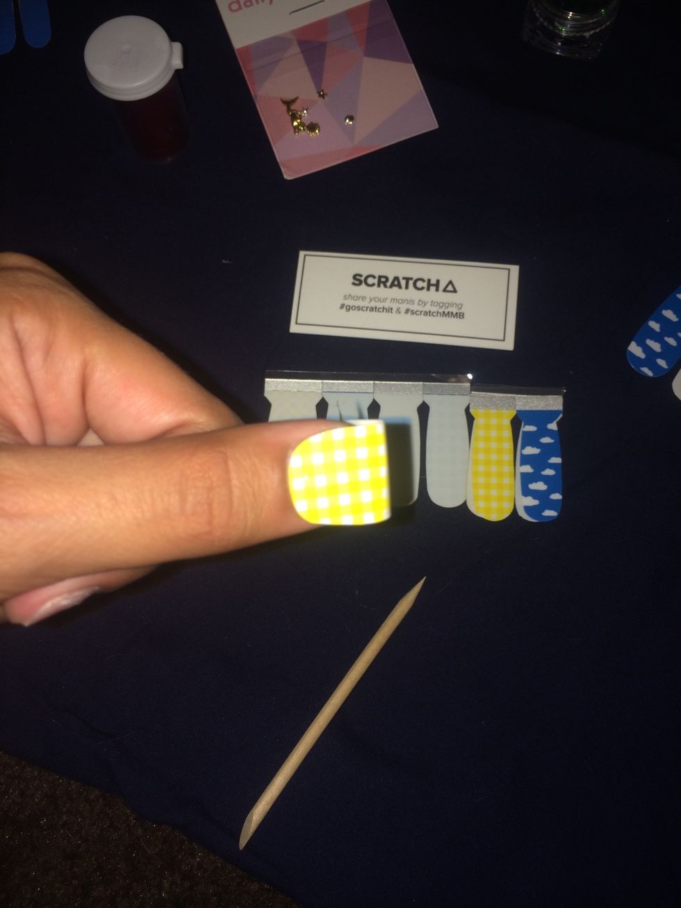 When you go to put it on, center it first. If the sticker fits perfectly it might be easier to start at the sides first. I like to push my cuticles back first before I put the sticker on.