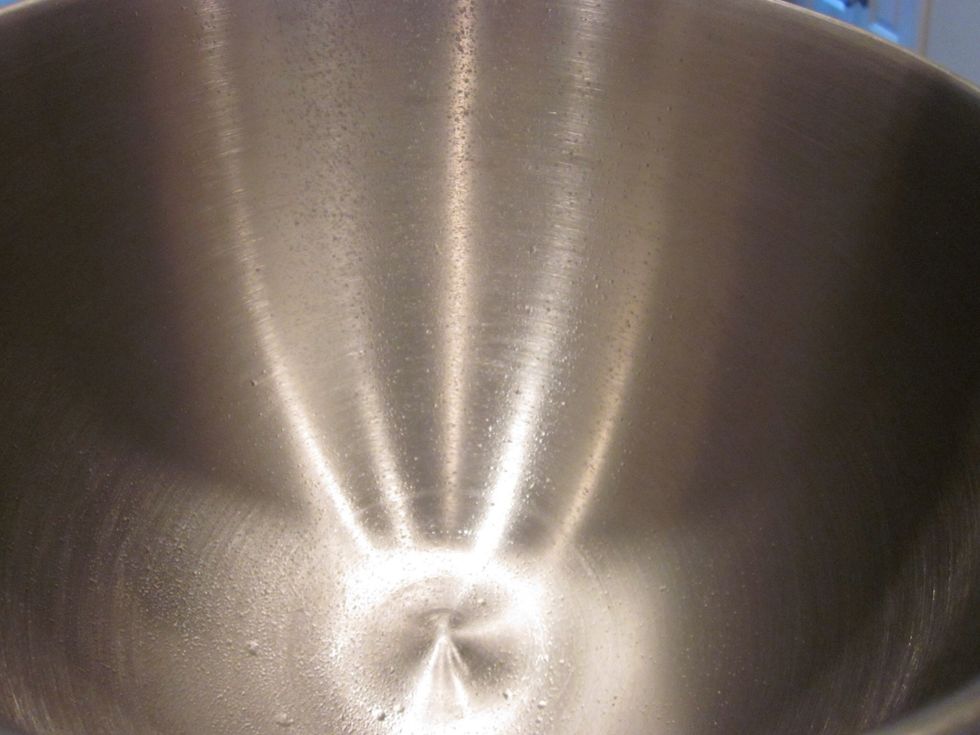 When you got it all kneaded, grab another bowl and spray it with some cooking spray.