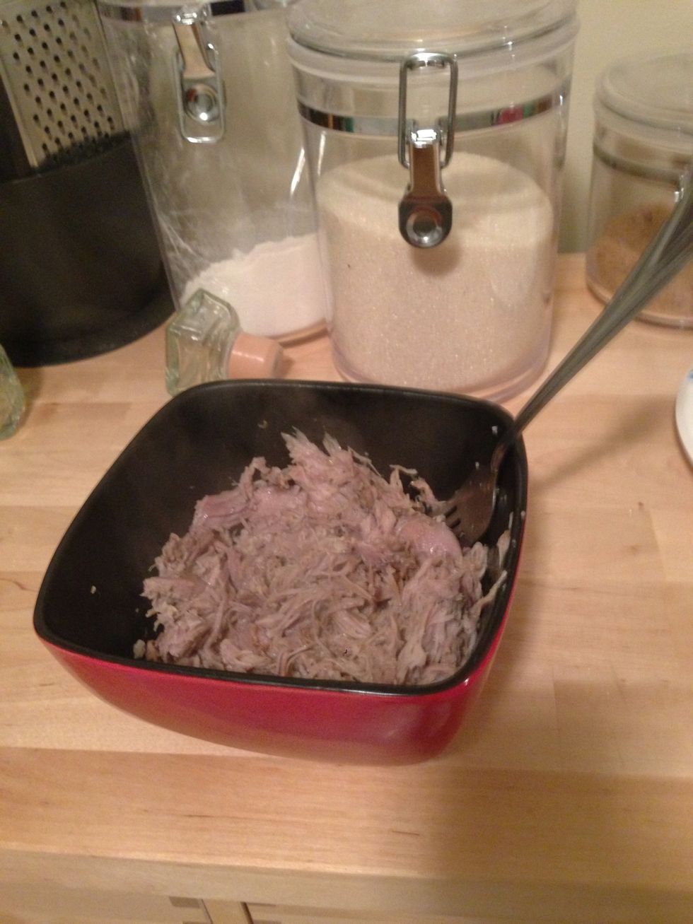 When you have a good portion sufficiently shredded, put in a bowl to mix with BBQ sauce.