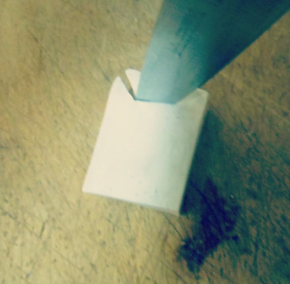 when you have both of your slits in you want to cut from the end of one slit to the other side it will basically be a straight line, you can make it more curved if you want to